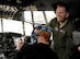 Staff Sgt. Michael Allen, a 731st Airlift Squadron C-130 Hercules loadmaster, teaches a high school student about the C-130’s capabilities and how to put on an oxygen mask April 27, 2017 at Peterson Air Force Base, Colo. The student is a member of the Navy Junior Reserve Officer Training Corps from Widefield High School. (U.S. Air Force photo/Staff Sgt. Amber Sorsek)
