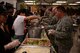 Airmen go through the food line at the Asian-American and Pacific Islander Heritage Group Taste of Asia lunch event at the Luke Air Force Base chapel May 2, 2017. The Taste of Asia lunch kicked off Asian-American and Pacific Islander Heritage month in the month of May for Luke and allowed Airmen from across the base to experience a culinary sample of Asian and Pacific culture. (U.S. Air Force photo by Airman 1st Class Ridge Shan)