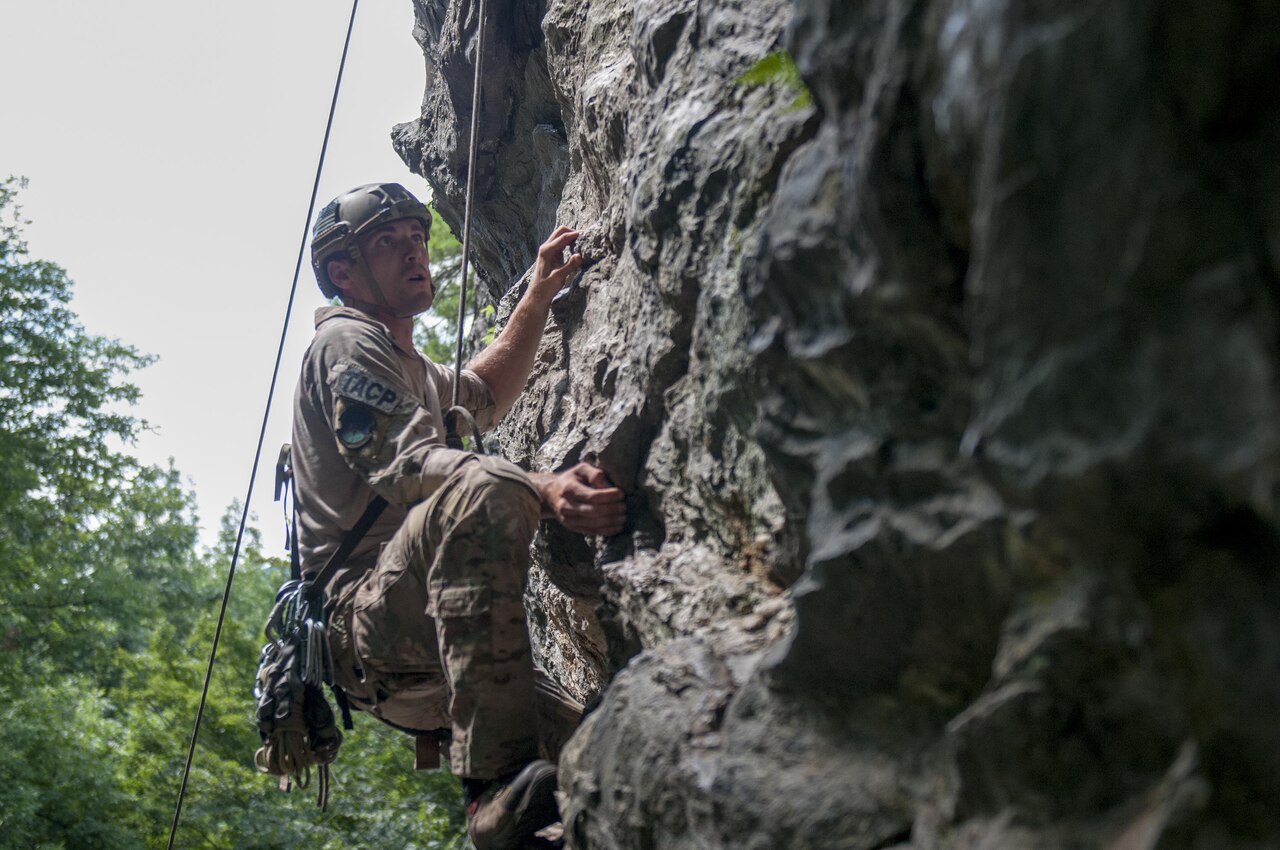 Air Force Staff Sgt. Mark Isaman, assigned to the 124th Air Support Operations Squadron with the Idaho National Guard, climbs a cliff face at the Camp Ethan Allen training site, Aug. 21, 2016. Isaman attends the Basic Mountain Warfare Course at the Army Mountain Warfare School, which provides tactical and technical training for mountain warfare operations. Army photo by Spc. Avery Cunningham