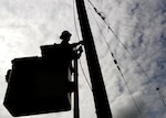 A construction worker prepares a power pole for removal at Beale Air Force Base, Calif. April 24, 2017. More than 200 poles are being replaced as part of an ongoing project to renovate Beale’s electrical infrastructure.