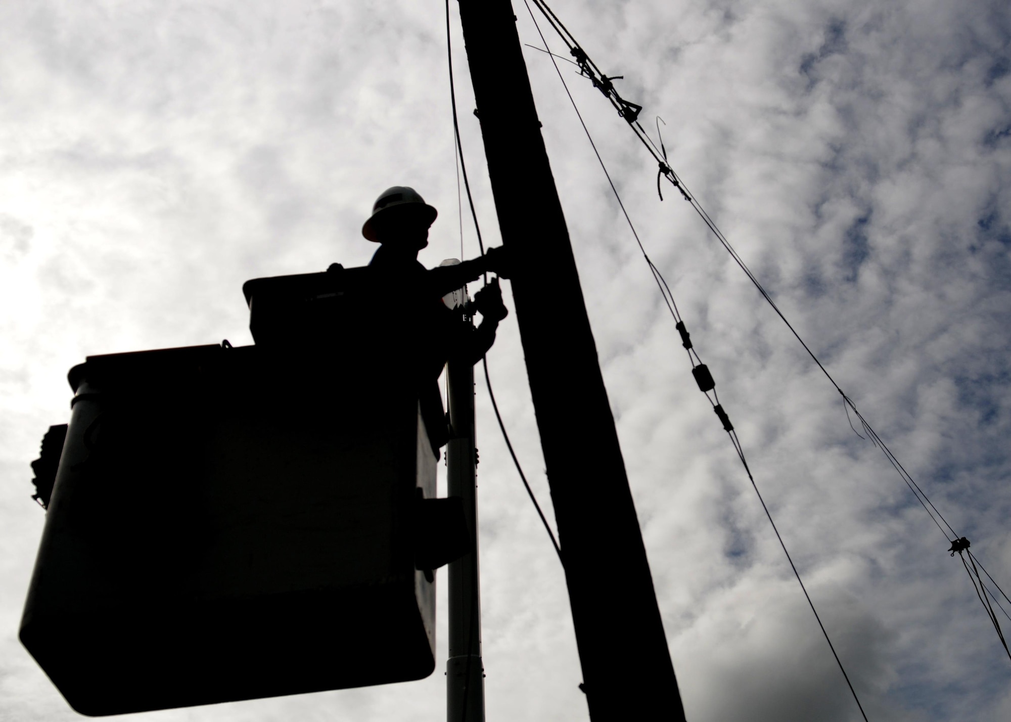 A construction worker prepares a power pole for removal at Beale Air Force Base, Calif. April 24, 2017. More than 200 poles are being replaced as part of an ongoing project to renovate Beale’s electrical infrastructure.