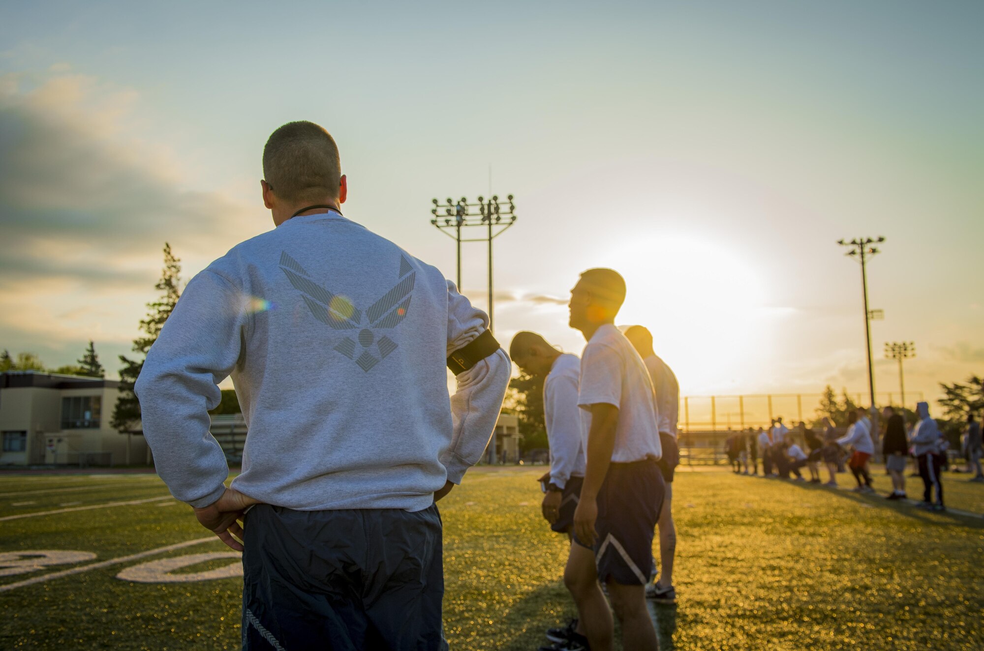 Participants of the Warrior Run prepare for morning workout April 28, 2017, at Yokota Air Base, Japan. The last Warrior Run yielded on average a 2.5 inch waistline reduction, 11 more pushups, 8 more sit-ups and a 2 minute decrease on the 1.5 mile run. (U.S. Air Force photo by Airman 1st Class Donald Hudson)