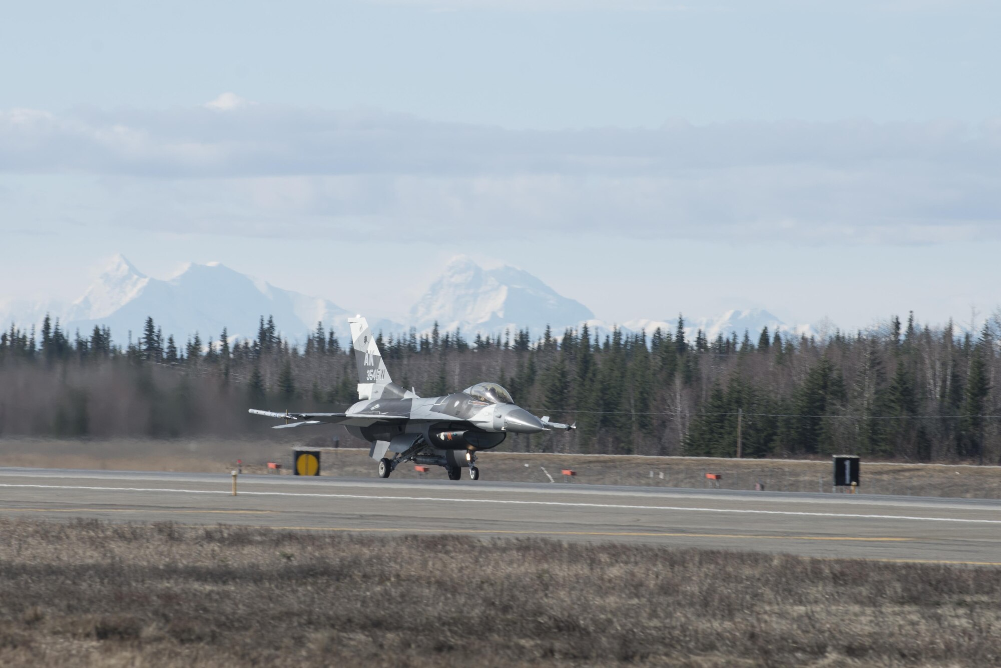 EIELSON AIR FORCE BASE, Alaska – The U.S. Air Force 354th Fighter Wing flagship F-16 Fighting Falcon aircraft assigned to the 18th Aggressor Squadron, takes off during NORTHERN EDGE 2017 (NE17), May 1, 2017, at Eielson Air Force Base, Alaska. NE17 is Alaska’s premier joint training exercise designed to practice operations, techniques and procedures as well as enhance interoperability among the services. Thousands of participants from all the services, Airmen, Soldiers, Sailors, Marines and Coast Guardsmen from active duty, Reserve and National Guard units are involved. (U.S. Air Force photo/Staff Sgt. Ashley Nicole Taylor)