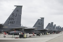 EIELSON AIR FORCE BASE, Alaska – U.S. Air Force F-15E Strike Eagle dual-role fighter aircraft assigned to the 335th Fighter Squadron, Seymour Johnson Air Force Base, N.C., are lined up on the Eielson Air Force Base, Alaska flight line, May 3, 2017 during NORTHERN EDGE 2017 (NE17). NE17 is Alaska’s premier joint training exercise designed to practice operations, techniques and procedures as well as enhance interoperability among the services. Thousands of participants from all the services, Airmen, Soldiers, Sailors, Marines and Coast Guardsmen from active duty, Reserve and National Guard units are involved. (U.S. Air Force photo/Staff Sgt. Ashley Nicole Taylor)