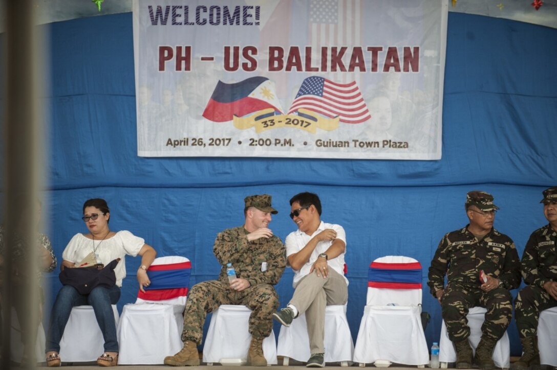 U.S. Marine 1st Lt. Martin Meehan and the Honorable Christopher Sheen P. Gonzales, the municipal mayor of Guiuan, speak before a groundbreaking ceremony during Balikatan 2017 at Guiuan, Eastern Samar, April 26, 2017. The Armed Forces of the Philippines along with U.S. military engineers worked together to build a new classroom at Surok Elementary School in Guiuan. Balikatan is an annual U.S.-Philippine military bilateral exercise focused on a variety of missions, including humanitarian assistance and disaster relief and counterterrorism. The increased interoperability between the U.S. military and Armed Forces of the Philippines will enhance readiness of humanitarian assistance and disaster relief capabilities. (U.S. Navy photo by Mass Communication Specialist 2nd Class Markus Castaneda) 