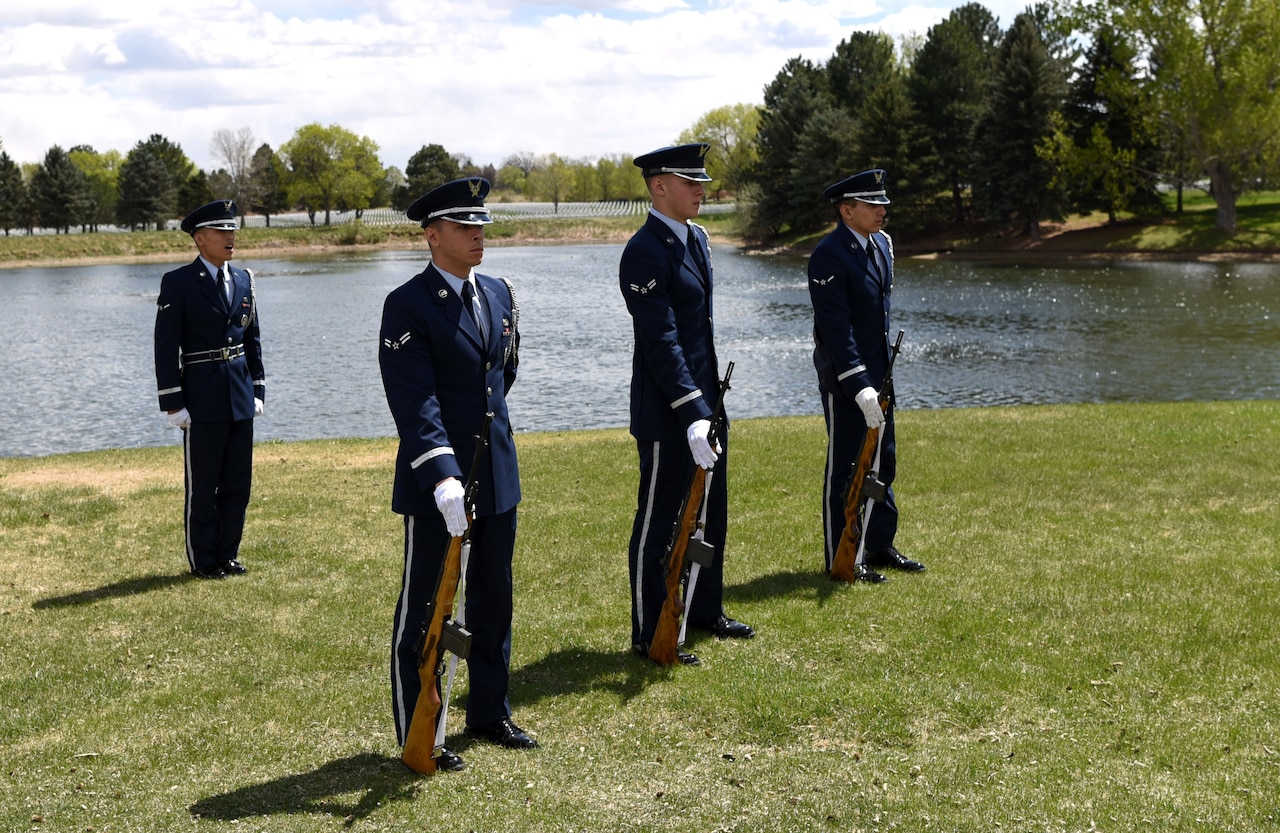 Airman Kyle Do, Mile High Honor Guard ceremonial guardsman, takes command of the firing detail during a military funeral honor, Apr. 28, 2017, at Fort Logan National Cemetery, Colo. The three member detail, carrying M-14 rifles, provided a three volley solute in honor of the deceased. Afterward, three fired rounds were presented to the next of kin. (U.S. Air Force photo by Airman 1st Class Holden S. Faul/ released)