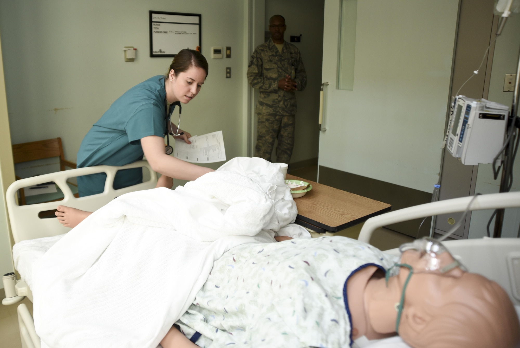 U.S. Air Force 2nd Lt. Emily Orlowicz, a 673rd In-Patient Operations Squadron clinical nurse from, Joint Base Elmendorf-Richardson, Alaska, inspects the mock patients for any errors that don’t comply with the doctor’s order as Mater Sgt. Anray Fiers 35th MDG Education and Training Manager, observes during the “room of horror” challenge in recognition of National Patient Safety Awareness Week at Misawa Air Base, Japan, April 25, 2017. The “room of horror” is a simulated patient’s hospital room riddled with errors from something as minor as the patient not having the call button within reach to major errors such as the bandage dressing being on the wrong leg. (U.S. Air Force photo by Staff Sgt. Melanie A. Hutto)