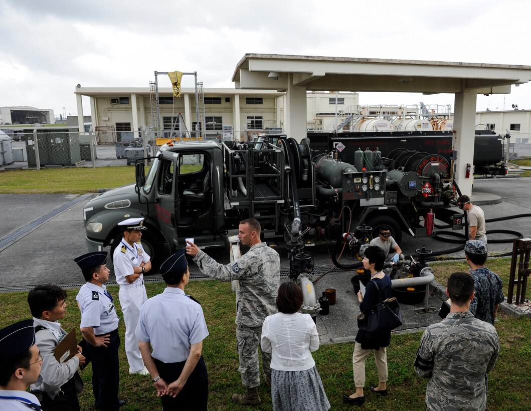 Japan Air Self-Defense Force Air Staff College members and 18th Logistics Readiness Squadron petroleum, oils and lubricants flight members observe 18th LRS facilities April 27, 2017, at Kadena Air Base, Japan. Tours of Kadena’s fuels facilities fosters relationships between U.S. service members and local Okinawan fuels professionals. (U.S. Air Force photo by Senior Airman Lynette M. Rolen)