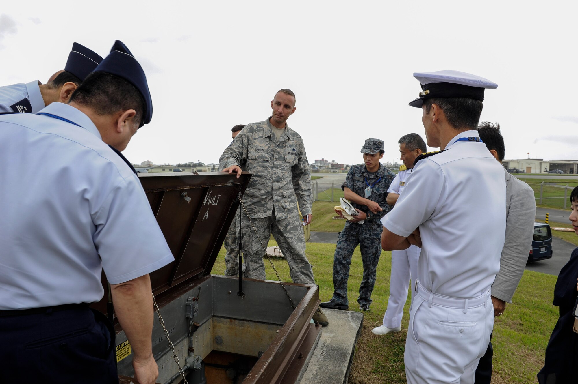 U.S. Air Force Tech. Sgt. Jeffrey Green, 18th Logistics Readiness Squadron fuels facilities NCO in charge, shows a tank vault to Japan Air Self-Defense Force Air Staff College members April 27, 2017, at Kadena Air Base, Japan. The fuel tank vault houses the fuel pumps for the Able Pump House, which is capable of housing approximately 200,000 thousand gallons of fuel. (U.S. Air Force photo by Senior Airman Lynette M. Rolen)