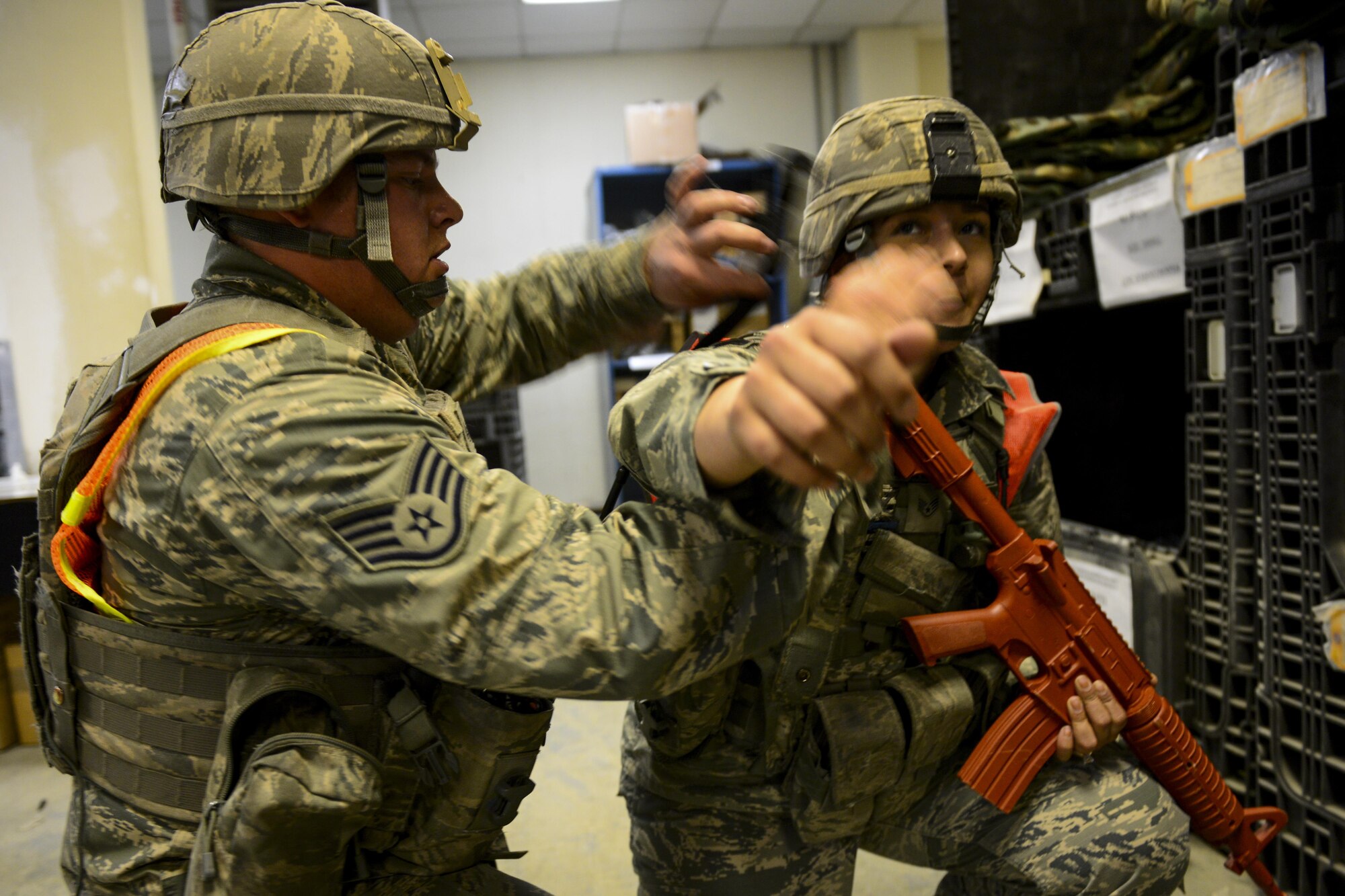 U.S. Air Force Staff Sgt. Corey Sokoloski tightens a tourniquet above a simulated gunshot wound on U.S. Air Force Staff Sgt. Lauriele McDermott’s arm during Exercise Beverly Sentinel 17-1 at Osan Air Base, Republic of Korea, May 4, 2017. The two 51st Security Forces Squadron Defenders were some of the first responders on the scene of the simulated shooting, leading to the encounter with the shooter that left McDermott wounded. (U.S. Air Force photo by Staff Sgt. Victor J. Caputo)