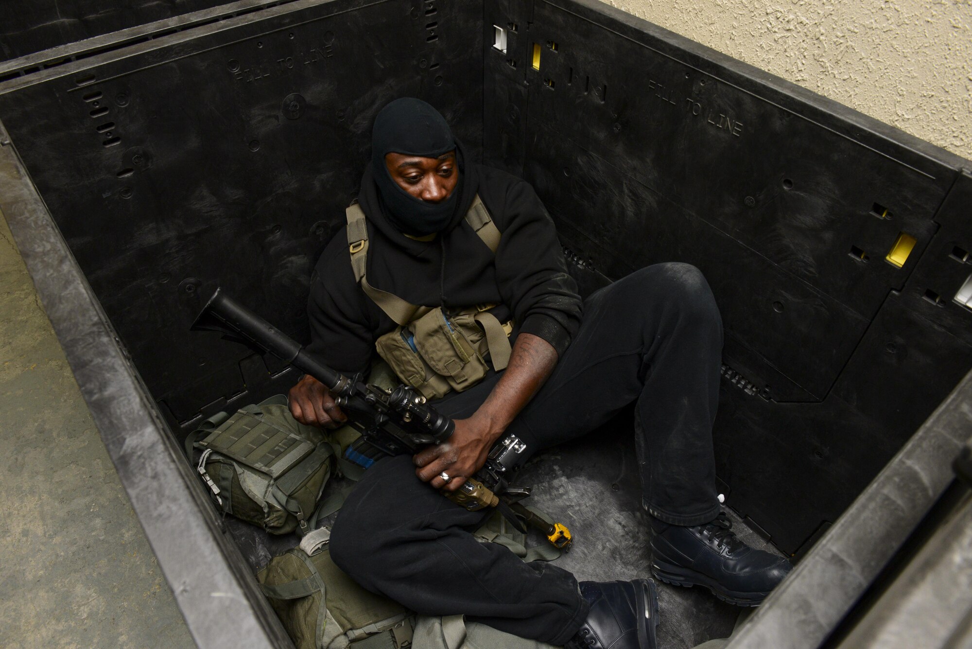 U.S. Air Force Tech. Sgt. Michael Denson, 51st Security Forces Squadron Defender, hides from other Defenders while simulating being a hostile gunman during Exercise Beverly Sentinel 17-1 at Osan Air Base, Republic of Korea, May 4, 2017. Beverly Sentinel exercises test Team Osan’s ability to react to threats like active shooters, requiring agencies ranging from command post to security forces to swiftly respond to the present threat. (U.S. Air Force photo by Staff Sgt. Victor J. Caputo)