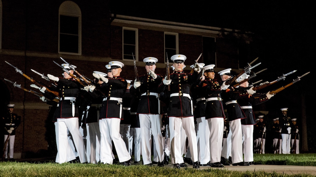 U.S. Marines with the Silent Drill Platoon demonstrate a "bursting bomb" during an evening parade dress rehearsal, Marine Barracks Washington, Washington, D.C., April 26, 2017. Evening parades are held as a means of honoring senior officials, distinguished citizens and supporters of the Marine Corps. 