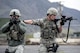 Staff Sgt. Richard Leslie, left, and Staff Sgt. Jacob Sime, both assigned to the 75th Security Forces Squadron, respond to a report of an active shooter and explosives during a response exercise at building 732, Hill Air Force Base, April 24, 2017. The realistic scenario involved a shooter and hostages inside the building, while outside the building an explosive device was planted at each entrance. (U.S. Air Force photo/Paul Holcomb)