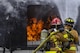Senior Airman Antonio Harmon and Tech. Sgt. Michael Gagnier, firefighters assigned to the 18th Civil Engineer Squadron, fight a fire during training April 26, 2017, at Kadena Air Base, Japan. The training helped the firefighters gain experience and build cohesiveness to work as a team for potential real-world scenarios. (U.S. Air Force photo /Senior Airman Nick Emerick)