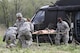 Army Reserve Spc. Ryan Flores and Spc. Bailey Jungmann of the 469th Medical Company, Wichita, Kansas team with Air Force Staff Sgt. Cherrelle Warren and Airman 1st Class Echo Heldreth of the 779th Medical Group from Macdill Air Force Base, Fla., rush to transport a mannequin patient from a UH-60 Black Hawk helicopter at Responders Support Camp Nighthawk, Ind., during Guardian Response 17, April 29, 2017. Nearly 5,000 Soldiers and Airmen from across the country participated in Guardian Response 17, a multi-component training exercise to validate the military's ability to support civil authorities in the event of a chemical, biological, radiological, and nuclear catastrophe. (U.S. Army Reserve photo/Staff Sgt. Christopher Sofia)