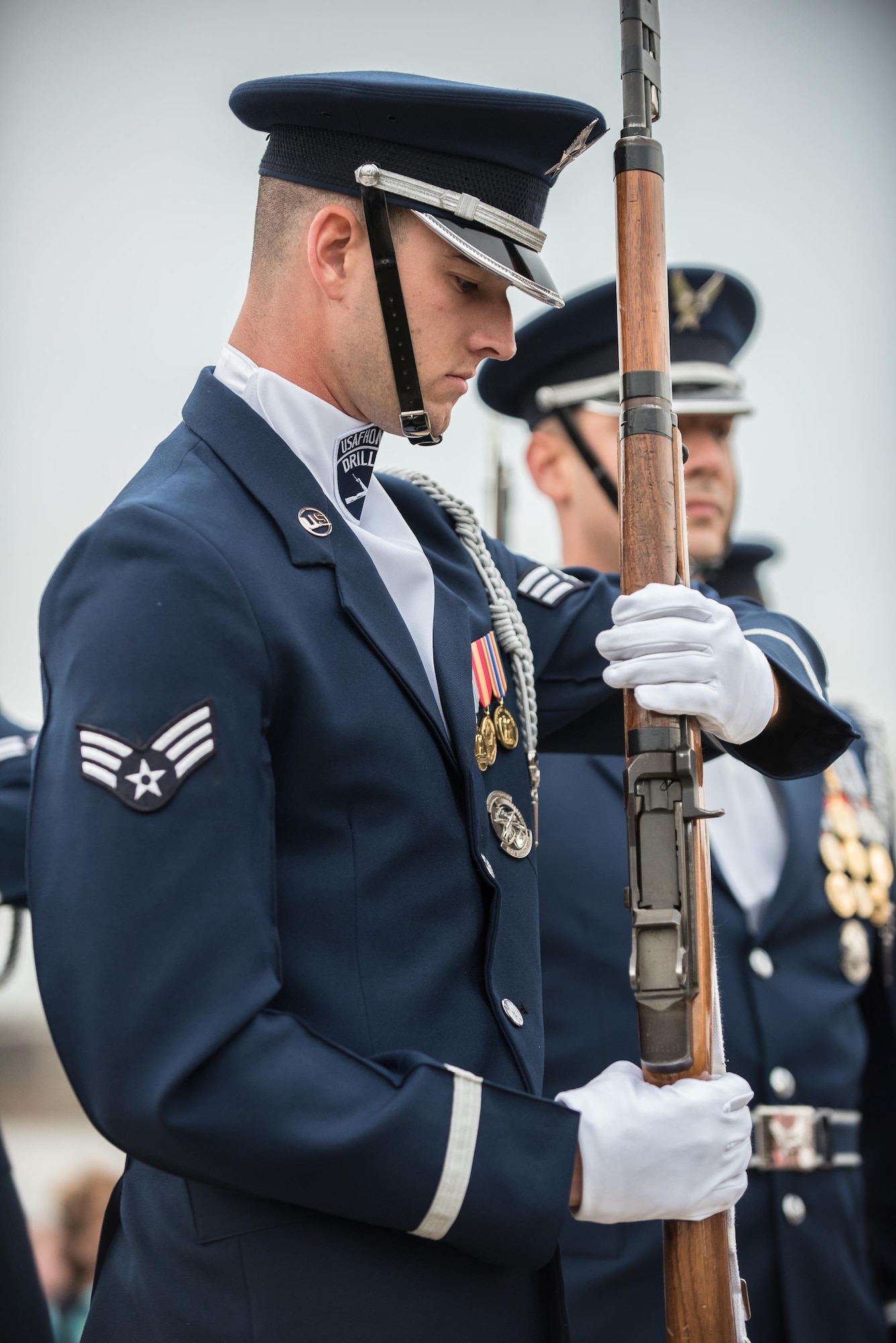 A member of the U.S. Air Force Honor Guard prepares to execute a precision rifle drill before an appreciative crowd at Waterfront Park in downtown Louisville, Ky., May 3, 2017, during the Kentucky Derby Festival. The Airman, from Joint Base Anacostia-Bolling in Washington, D.C., is part of a team that strives to represent the Air Force Core Values of integrity, service and excellence through precise drill movements, immaculate appearance and extreme attention to detail. (U.S. Air National Guard photo by Lt. Col. Dale Greer)