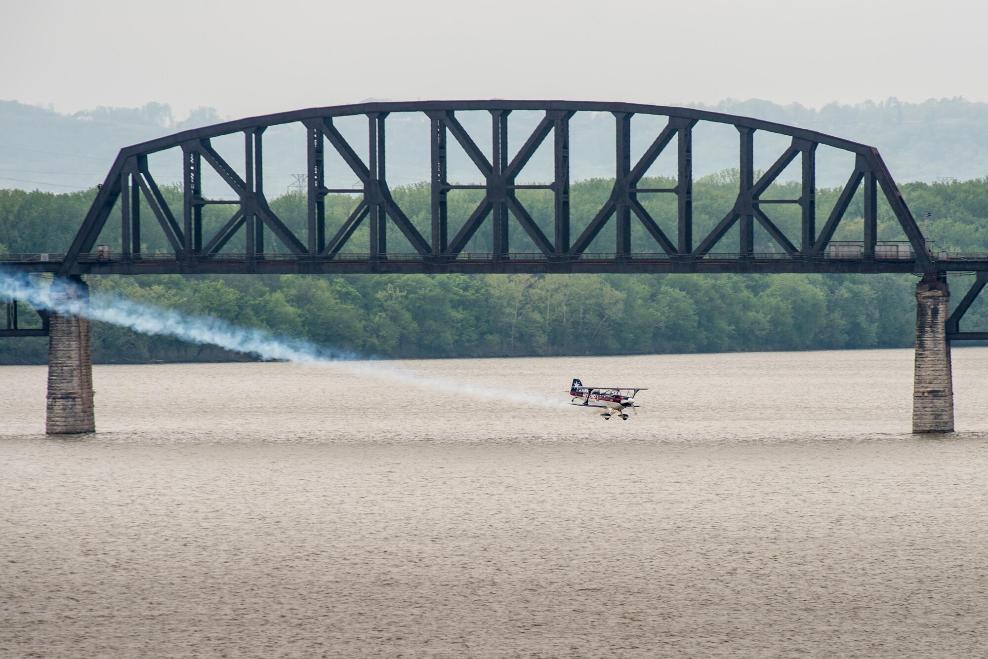 Pilot Billy Werth flies his Pitts S-2C aircraft low over the Ohio River during the Thunder Over Louisville air show in Louisville, Ky., April 22, 2017. The event, which features more than a dozen aircraft, has grown to become the largest annual single-day air show in America. (U.S. Air National Guard photo by Lt. Col. Dale Greer)