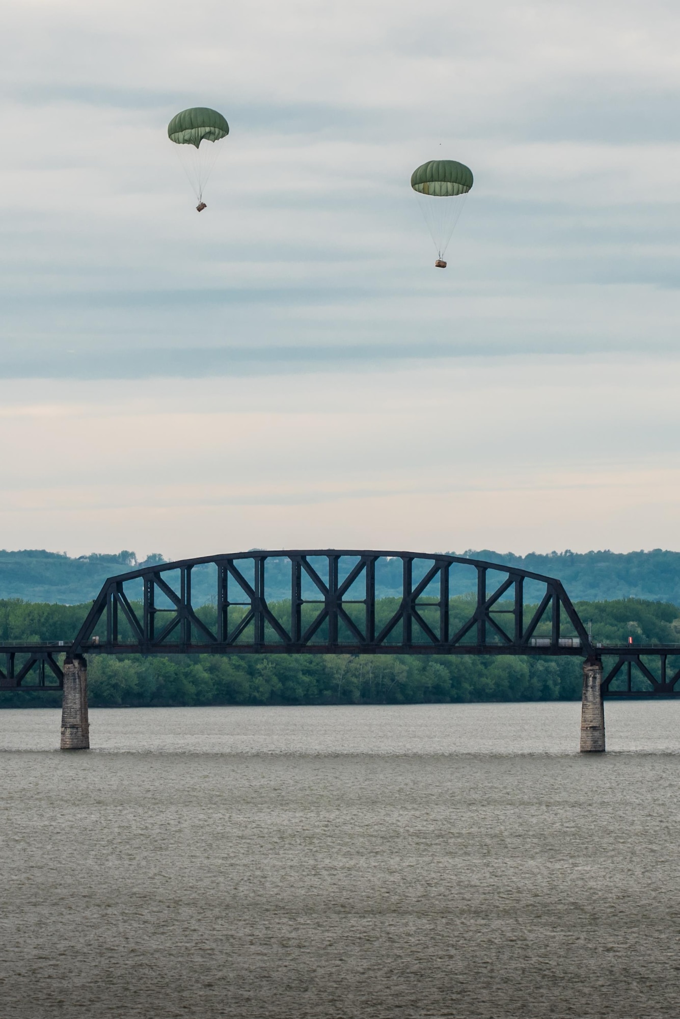 Two bundles of cargo float down to the Ohio River after being air-dropped from a Kentucky Air National Guard C-130 Hercules aircraft April 22, 2017, during the Thunder Over Louisville air show in Louisville, Ky. The annual event has grown to become the largest single-day air show in the nation. (U.S. Air National Guard photo by Lt. Col. Dale Greer)