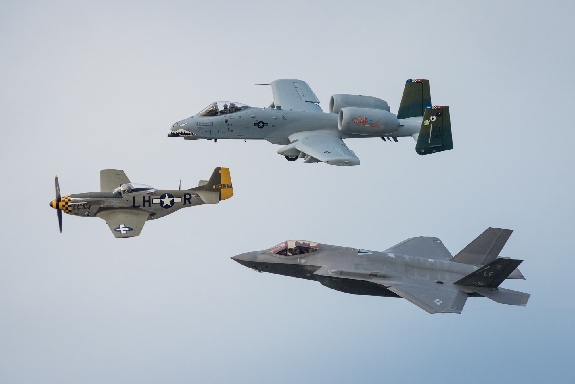 In honor of the U.S. Air Force 70th Anniversary, a trio of historic and modern aircraft fly an aerial demonstration over the Ohio River during the Thunder Over Louisville air show in Louisville, Ky., April 22, 2017. The group is comprised of (from left to right) a P-51 Mustang fighter-bomber, a U.S. Air Force A-10 Thunderbolt II close air support aircraft and a U.S. Air Force F-35 Lightning II. The F-35, from Luke Air Force Base, Ariz., is the Air Force’s newest fighter aircraft. (U.S. Air National Guard photo by Lt. Col. Dale Greer)