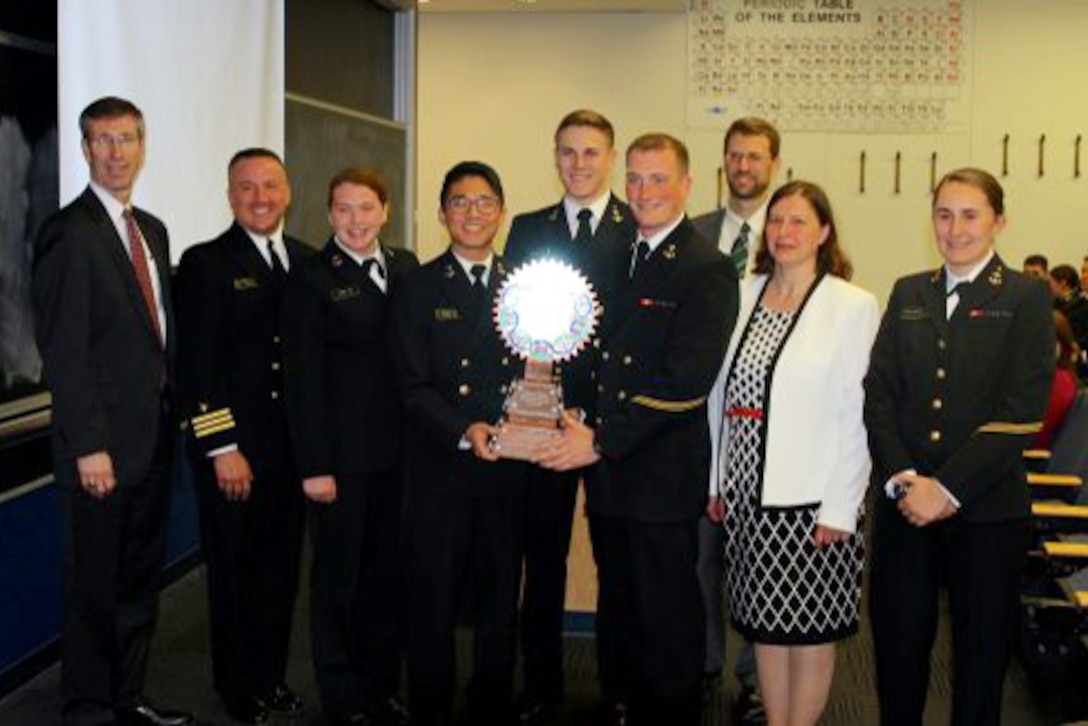 Defense Threat Reduction Agency challenge team winners and  staff at trophy presentation Photo courtesy: U.S. Naval Academy