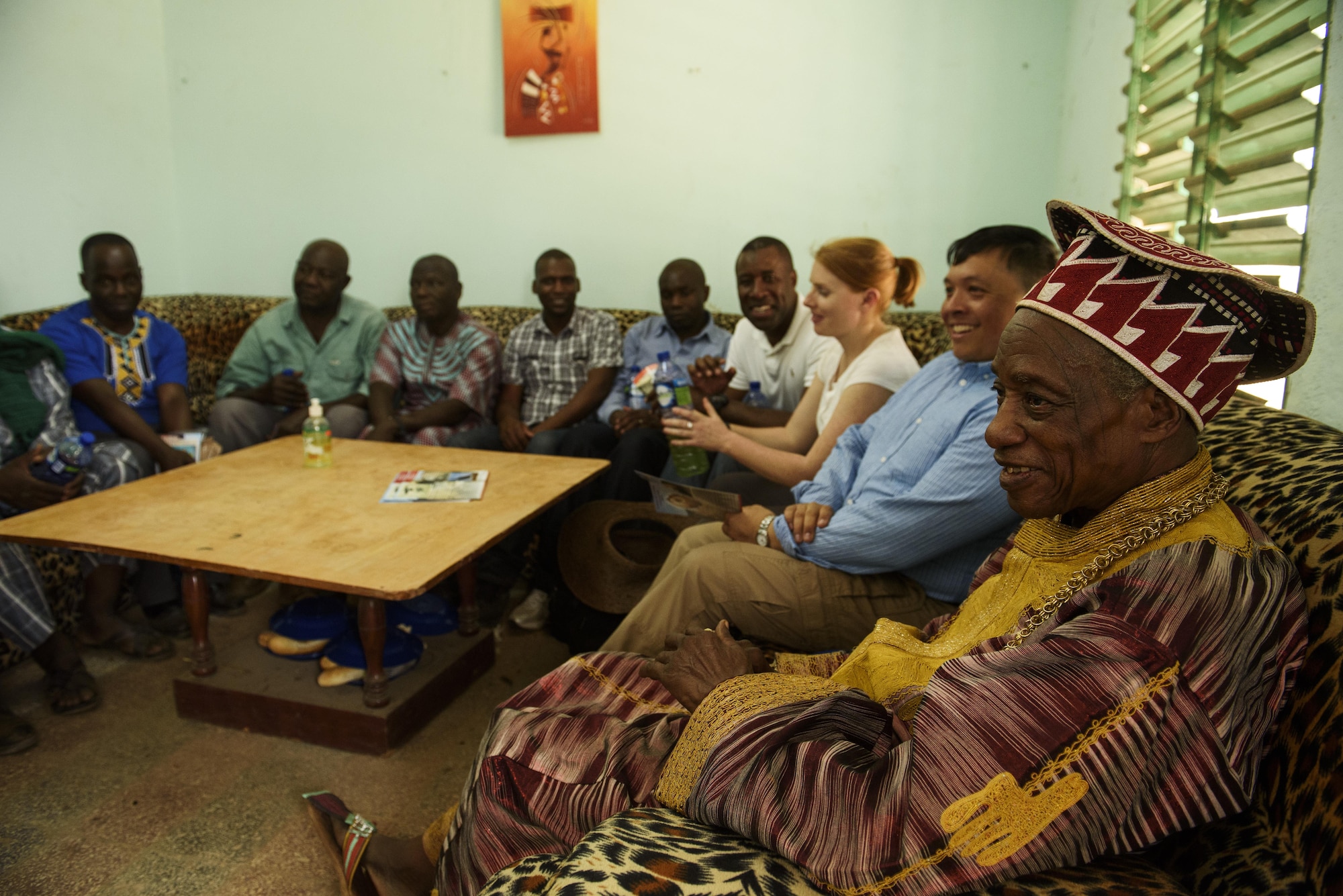Participants of African Partnership Flight talks with Titinga Frédéric Pacéré, during a cultural tour near Ouagadougou, Burkina Faso, April 17, 2017. APF in Burkina Faso hosted participants from Chad, Mali, Mauritania, Niger, Cote d’Ivoire and Morocco to help strengthen relationships and share best practices. (U.S. Air Force photo by Staff Sgt. Jonathan Snyder)