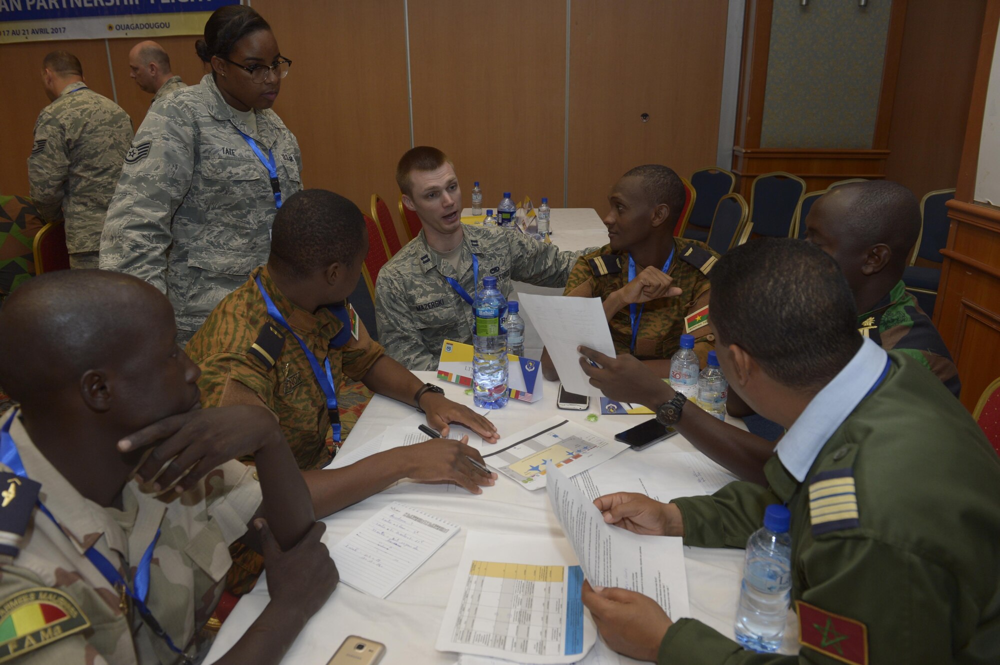 U.S. Air Force Capt. Ian Mazerski, 321st Contingency Response Squadron maintenance flight commander, talks with African Partnership Flight participants during a table top workshop in Ouagadougou, Burkina Faso, April 20, 2017. The intent of APF is to build strong transparent partnerships that enhance regional stability and security through formal alliances, partnerships and simple exchanges of information. (U.S. Air Force photo by Staff Sgt. Jonathan Snyder)