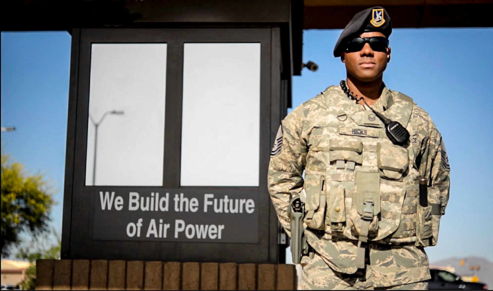 Master Sgt. David Hicks, 56th Security Forces Squadron NCO in charge of standards and evaluations, stands post at a gate during his shift April 18, 2017, at Luke Air Force Base, Ariz. Hicks endured an upbringing of physical and emotional abuse, drug filled streets and foster care which encouraged him to change his life and join the Air Force. (U.S. Air Force photo by Airman 1st Class Caleb Worpel)