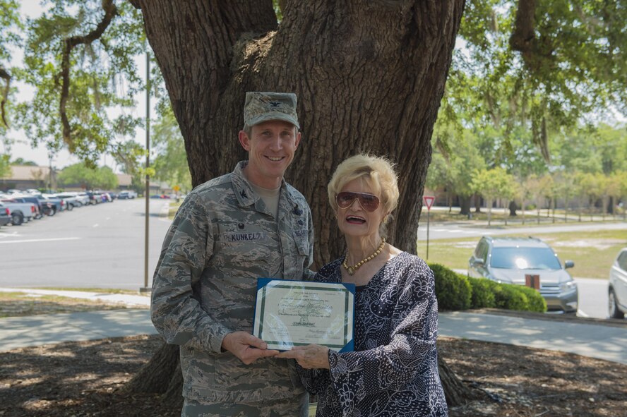 Col. Thomas Kunkel, 23d Wing Commander, left, presents “Flying Tiger Oak’s” Live Oak Society certificate to Dr. Lucy Greene, Moody Support Committee executive director, April 28, 2017, at Moody Air Force Base, Ga. This tree is one of approximately 8,300 nationally registered live oaks across 14 states, known for its prestigious tradition, location and size. Greene, Moody Support Committee executive director, reached out to community leaders about getting the tree recognized, which was accepted for its significance of pre-dating Moody AFB and being symbolic of the communities’ bond. 