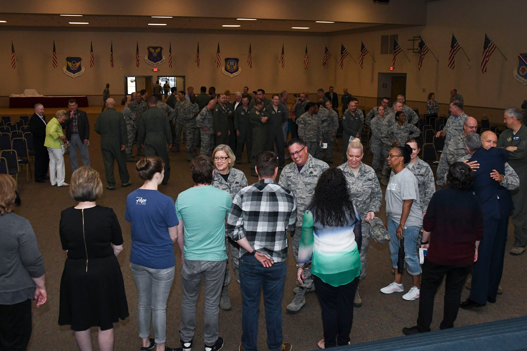 A receiving line forms to congratulate Col. James L. Morriss III, vice commander of the 307th Bomb Wing, and his family for 31 years of military service at Barksdale Air Force Base, La., April 29, 2017.  Morriss retires as a master navigator with more than 4,500 flight hours in the B-52 G/H, T-37 Tweet and Boeing T-43. (U.S. Air Force photo by Staff Sgt. Callie Ware/Released)
