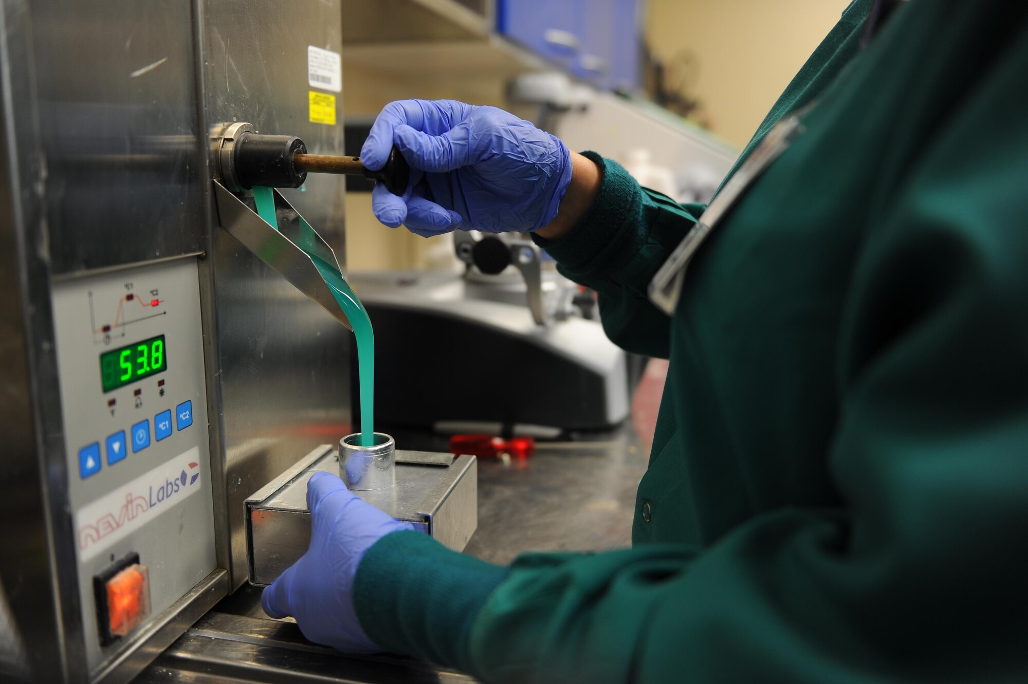Master Sgt. Candice Reffitt, dental laboratory flight chief with the 1st Special Operations Dental Squadron, uses a hydrocolloid duplicating machine to create mold for an acrylic night guard at Hurlburt Field, Fla., May 1, 2017. Hydrocolloid is used to make acrylic the dental laboratory fabricates crowns, bridges, implants, night guards and sports guards. (U.S. Air Force photo by Airman 1st Class Isaac O. Guest IV)