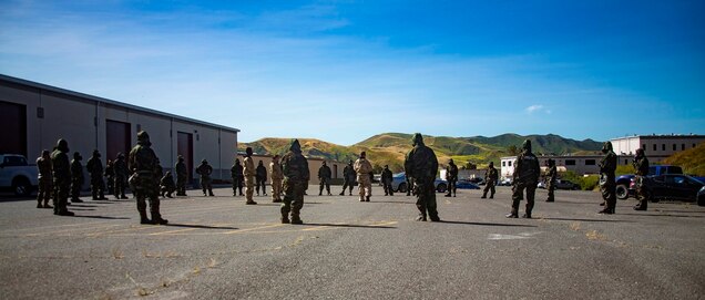 U.S. Marines from 1st Maintenance Battalion, 1st Marine Logistics Group, gather trainees to conduct Reconnaissance, Surveillance and Decontamination Training aboard Marine Corps Base Camp Pendleton, Calif., April 26, 2017. The trainees are receiving one final brief before separating into their training groups. The purpose of this training is to accomplish missions within a chemical, biological, radiological and nuclear environment. (U.S. Marine Corps photo by Lance Corporal Salmineo Sherman Jr./Released)