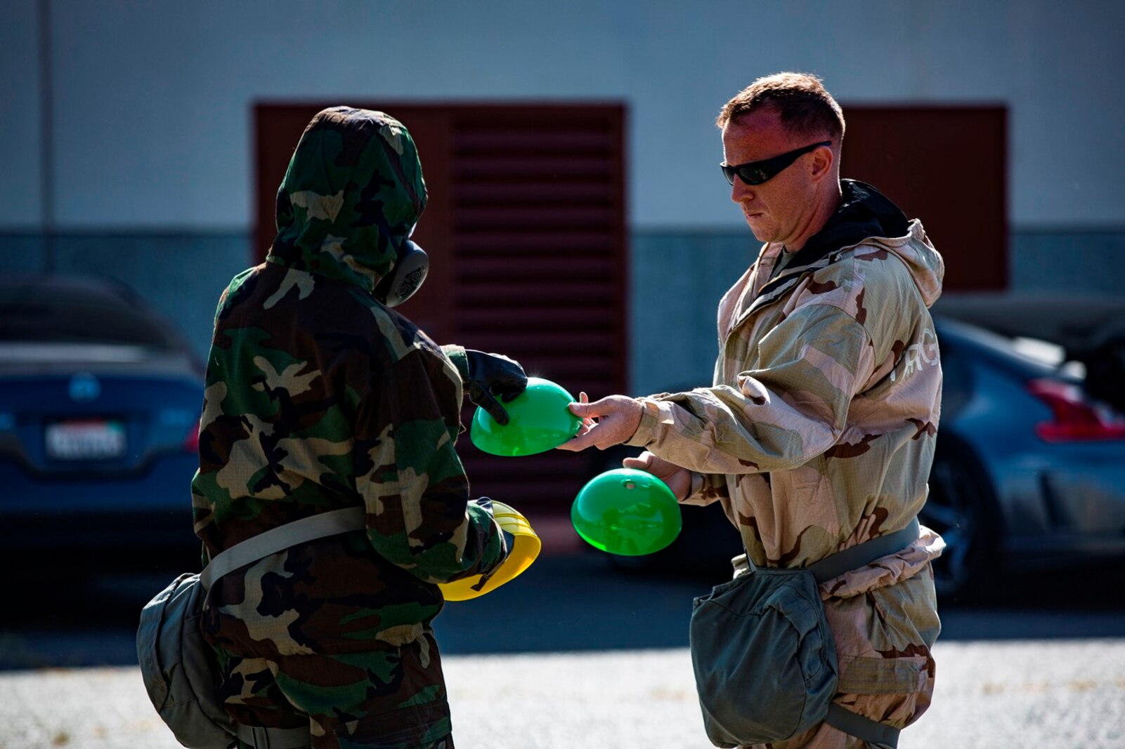 U.S. Marine Staff Sgt. Philip Barnes hands out cones to conduct Reconnaissance, Surveillance and Decontamination Training aboard Marine Corps Base Camp Pendleton, Calif., April 26, 2017. The cones serve as simulated threats and hazards in a chemical, biological, radiological and nuclear environment. The purpose of this training is to accomplish missions within CBRN environment.  Barnes is the current CBRN Chief for 1st Maintenance Battalion, 1st Marine Logistics Group. (U.S. Marine Corps photo by Lance Corporal Salmineo Sherman Jr./Released)