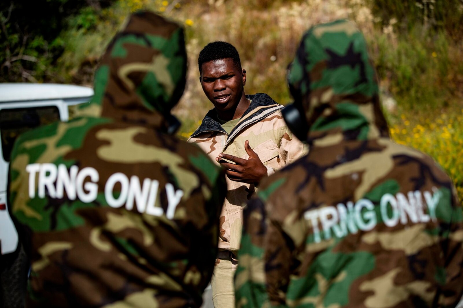 U.S. Marine Lance Cpl. Lavon McDonald talks to trainees about the Reconnaissance, Surveillance and Decontamination Training aboard Marine Corps Base Camp Pendleton, Calif., April 26, 2017. The purpose of this training is to accomplish missions within a chemical, biological, radiological and nuclear environment. McDonald is the Hazmat Noncommissioned Officer-In-Charge for 1st Maintenance Battalion, 1st Marine Logistics Group. (U.S. Marine Corps photo by Lance Corporal Salmineo Sherman Jr./Released)