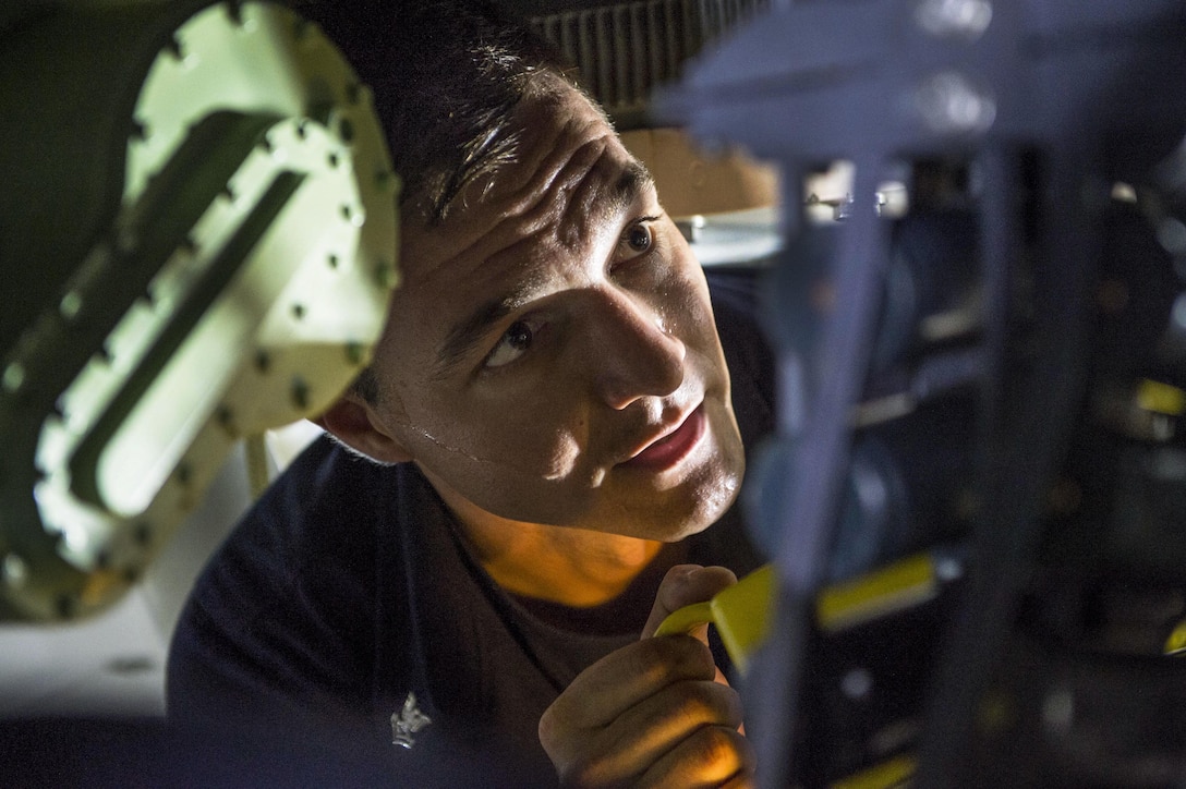 Navy Petty Officer 2nd Class Matthew Pruskauer works on an MK50 gun weapon system aboard the USS Coronado in the Singapore Strait, May 2, 2017. The littoral combat ship is on a rotational deployment in the U.S. 7th Fleet area of responsibility. Navy photo by Petty Officer 3rd Class Deven Leigh Ellis