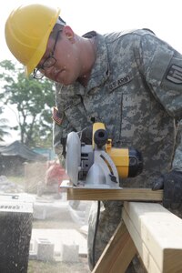 U.S. Army Spc. Sam Powell, with the 372nd Engineer Company, cuts wooden beams at St. Matthew's School construction site for Beyond the Horizon 2017, St. Matthew's Belize, May 1, 2017. Beyond the Horizon is a U.S. Southern Command-sponsored, Army South-led exercise designed to provide humanitarian and engineering services to communities in need, demonstrating U.S. support for Belize. (U.S. Army photo by Spc. Gary Silverman)