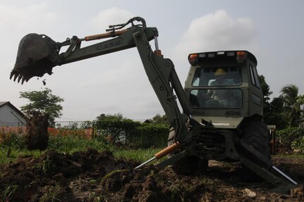 U.S. Army Sgt. Tyler Brady, with the 372nd Engineer Company, widens a pit for the foundation of a new latrine at the St. Matthew's School as part of a broader school construction project for Beyond the Horizon 2017, St. Matthew's, Belize, May 1, 2017. Beyond the Horizon is a U.S. Southern Command-sponsored, Army South-led exercise designed to provide humanitarian and engineering services to communities in need, demonstrating U.S. support for Belize. (U.S. Army photo by Spc. Gary Silverman)