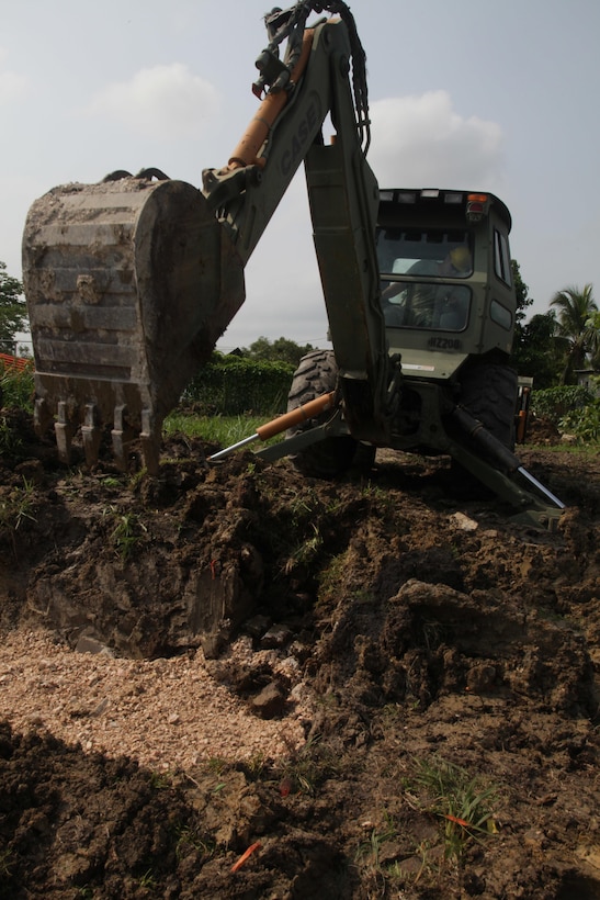 U.S. Army Sgt. Tyler Brady, with the 372nd Engineer Company, widens a pit for the foundation of a new latrine at the St. Matthew's School as part of a broader school construction project for Beyond the Horizon 2017, St. Matthew's, Belize, May 1, 2017. Beyond the Horizon is a U.S. Southern Command-sponsored, Army South-led exercise designed to provide humanitarian and engineering services to communities in need, demonstrating U.S. support for Belize. (U.S. Army photo by Spc. Gary Silverman)