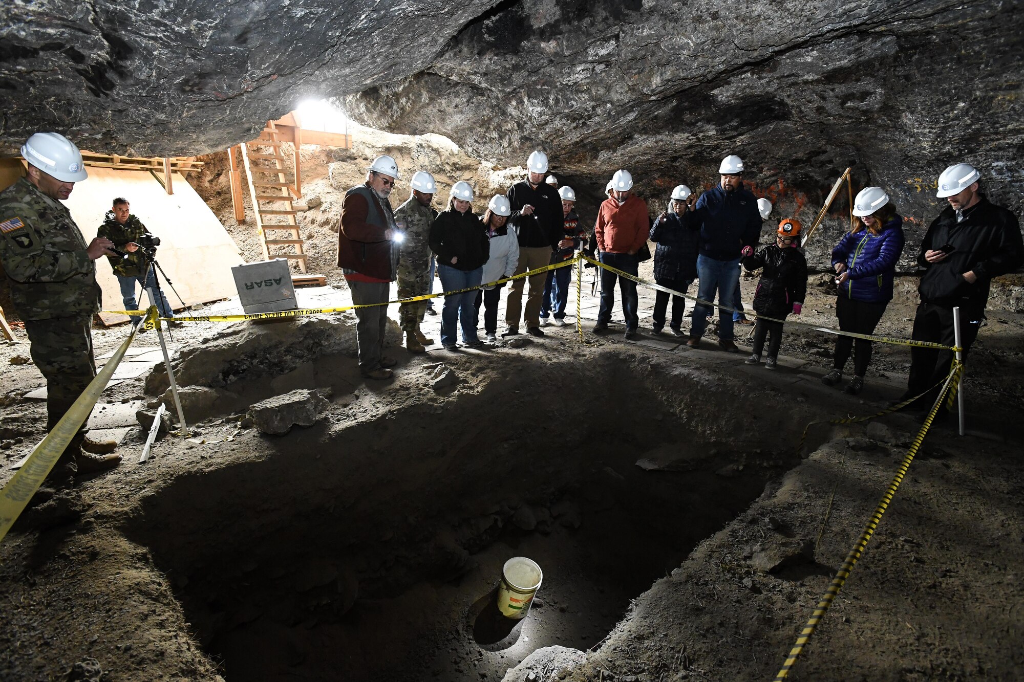 Representatives from American Indian tribes and DOD agencies take part in a guided tour of Danger Cave, Wendover, Utah, April 28, 2017. The tour was part of an annual face-to-face meeting between DOD representatives and members of several American Indian tribes who claim ancestral and ongoing ties to lands managed by the DOD agencies. (U.S. Air Force photo/R. Nial Bradshaw)