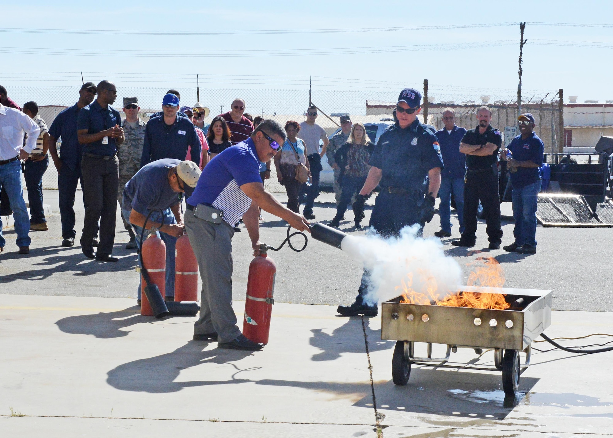 The 412th Logistics Readiness Squadron held a mass fire extinguisher training event May 3. (U.S. Air Force photo by Kenji Thuloweit)