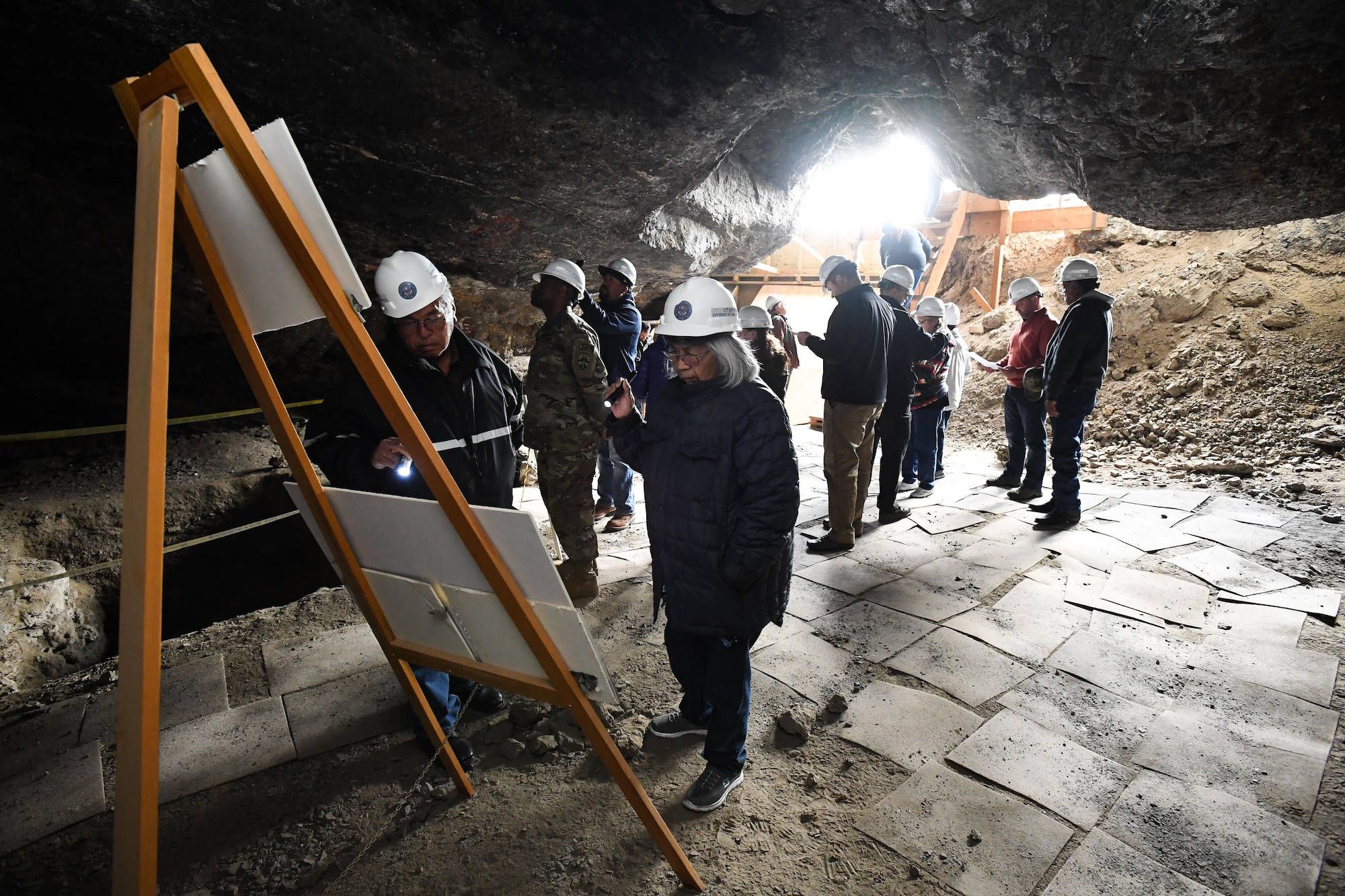 Representatives from American Indian tribes and DOD agencies take part in a guided tour of Danger Cave, Wendover, Utah, April 28, 2017. The tour was part of an annual face-to-face meeting between DOD representatives and members of several American Indian tribes who claim ancestral and ongoing ties to lands managed by the DOD agencies. (U.S. Air Force photo/R. Nial Bradshaw)