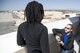 Daniel Ciolkosz, 775th Test Squadron, gets on one knee to propose to Amarachi Egbuziem, 772nd Test Squadron, at the Edwards control tower April 19. (U.S. Air Force photo by Christian Turner)