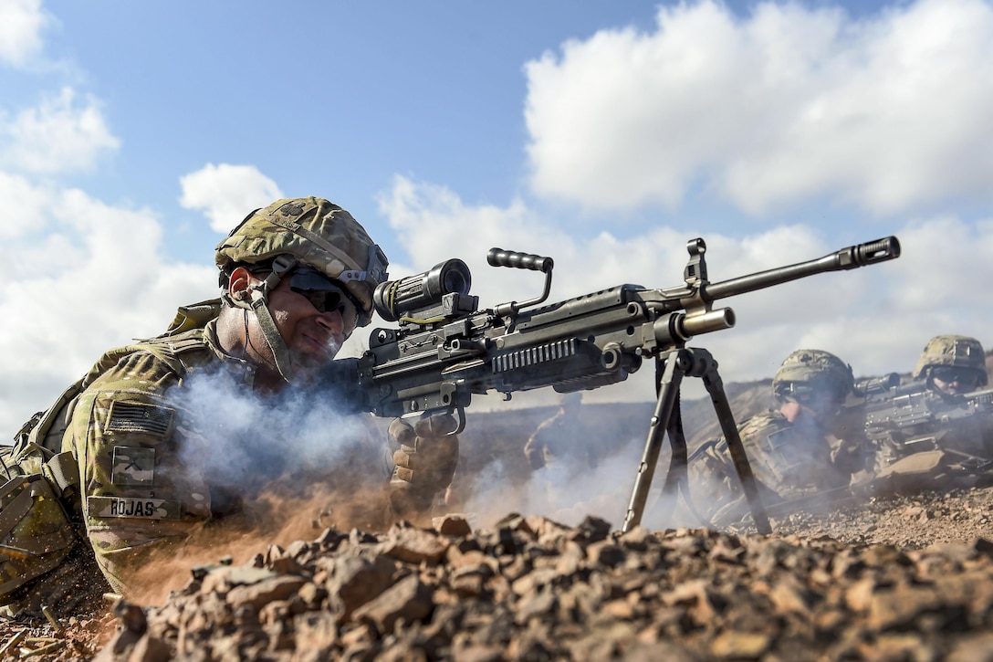 Army Pvt. Michael Rojas fires an M249 light machine gun during small arms training in Arta, Djibouti, May 2, 2017. Rojas is assigned to Combined Joint Task Force Horn of Africa's East African Response Force. Air Force photo by Staff Sgt. Nicholas M. Byers