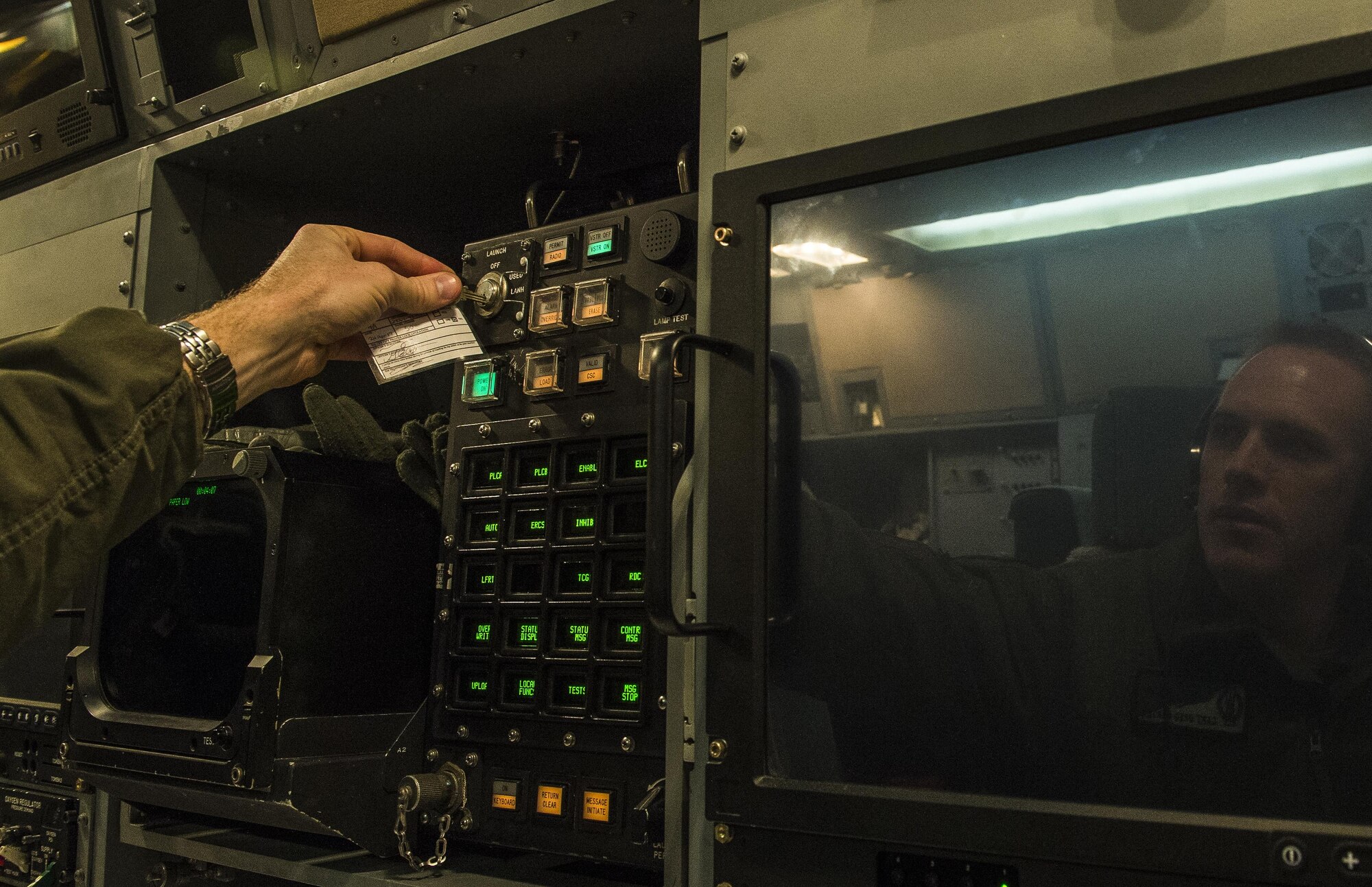 U.S. Air Force Capt. Greg Carter, a deputy missile combat crew commander-airborne from the 625th Strategic Operations Squadron, launches a simulated Minuteman III missile aboard a U.S. Navy E-6B Mercury during Glory Trip 220 above the Pacific Ocean, April 25, 2017. Glory Trip is an operational test launch which continues a long history of launches from Vandenberg Air Force Base, Calif., used to verify, validate and improve the capability of the nation’s ICBM force. (U.S. Air Force photo by Airman 1st Class Keifer Bowes)