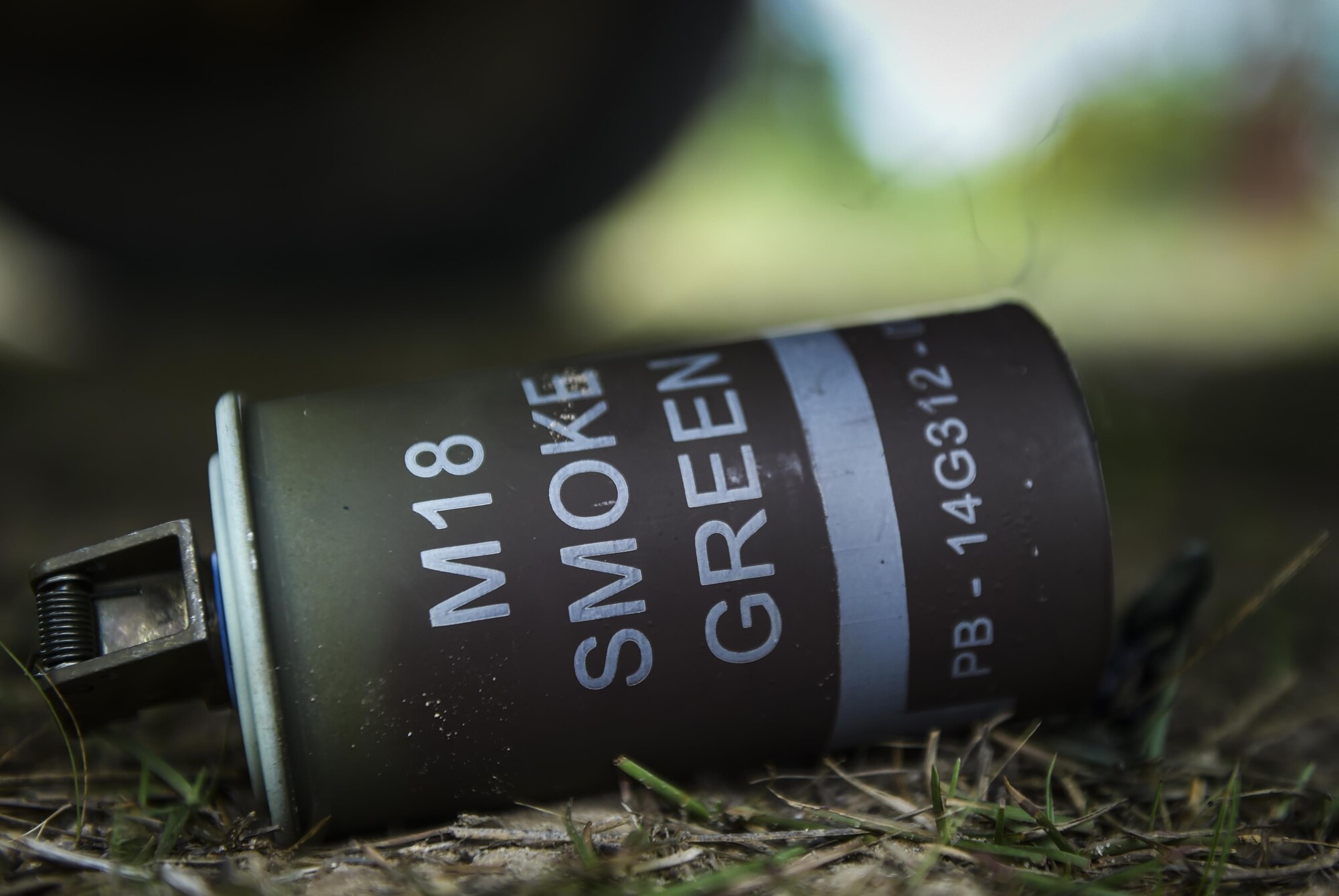 An M18 smoke grenade is used to shelter the positions of 6th Special Operations Squadron combat aviation advisor students while they navigated through “Palmetto Land” during Operation Raven Claw at Duke Field, Fla., April 27, 2017. Throughout Raven Claw, students faced different scenarios to include providing casualty treatment for local civilians, handling potential human rights violations and reacting to improvised explosions during the middle of the night. (U.S. Air Force photo by Airman 1st Class Joseph Pick)
