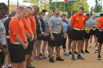 Soldier, civilians and their families gather outside of Marshall Hall at Fort Bragg, N.C., to participate in the National Day of Prayer 2017. Soldiers and civilians set aside time to reflect and pray for our country during this event. With an emphasis on both spiritual and physical fitness, they ran for approximately forty-five minutes, using this time to reflect and pray. The National Day of Prayer is recognized around the nation on the first Thursday of May every year. It is a time for people around the nation to gather and set aside a time of prayer for the country and its leaders.