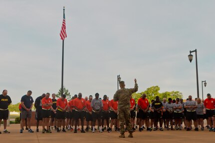 Chaplain (Col.) David Waters, Fort Bragg, N.C., Garrison Chaplain, leads a formation in a time of pray as Soldier, civilians and their families gather outside of Marshall Hall to participate in the National Day of Prayer 2017. Soldiers and civilians set aside time to reflect and prayer for our country during this event. With an emphasis on both spiritual and physical fitness, they ran for approximately 45 minutes, using this time to reflect and pray as well as work on physical fitness. The National Day of Prayer is recognized around the nation on the first Thursday of May every year. It is a time for people around the nation to gather and set aside a time of prayer for the country and its leaders.