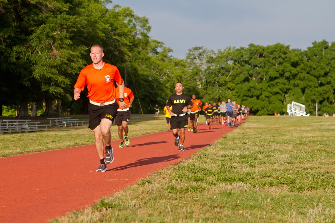 Soldier, civilians and their families gather outside of Marshall Hall at Fort Bragg, N.C., to participate in the National Day of Prayer 2017. Soldiers and civilians set aside time to reflect and pray for our country during this event. With an emphasis on both spiritual and physical fitness, they ran for approximately forty-five minutes, using this time to reflect and pray. The National Day of Prayer is recognized around the nation on the first Thursday of May every year. It is a time for people around the nation to gather and set aside a time of prayer for the country and its leaders.