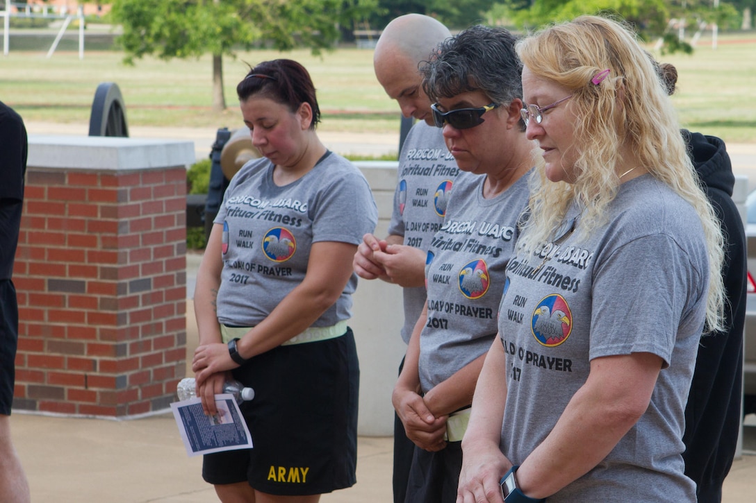 Soldier, civilians and their families gather outside of Marshall Hall at Fort Bragg, N.C., to participate in the National Day of Prayer 2017. Soldiers and civilians set aside time to reflect and pray for our country during this event. With an emphasis on both spiritual and physical fitness, they ran for approximately forty-five minutes, using this time to reflect and pray. The National Day of Prayer is recognized around the nation on the first Thursday of May every year. It is a time for people around the nation to gather and set aside a time of prayer for the country and its leaders.