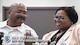 Michael L. Chavis, a Gold Star parent, shows his new Gold Star Base Access ID card to Carla Diamond, a U.S. Air Force Headquarters community readiness consultant, at Joint Base Andrews, Md., May 1, 2017. These cards are part of an Air Force initiative allowing Gold Star family members, immediate relatives of deceased Airmen, unescorted access to Air Force installations to visit buried loved ones, attend base events, and stop by Airmen and mily Readiness Centers for support. (U.S. Air Force photo/Senior Airman Jordyn Fetter)