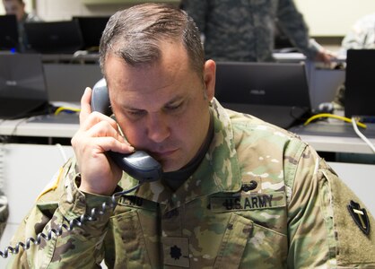 Lt. Col. Jeremy Sereno, a cyber operations chief of the Texas Army National Guard out of Marshall, Texas, answers a phone inquiry as part of the Exercise Cyber Shield 17 multi-service training exercise conducted at Camp Williams, Utah, on May 2, 2017. Exercise Cyber Shield 17 is the sixth iteration of this training exercise and this year unites the Army National Guard with members of the Air National Guard, Army Reserve, and civilians from private companies, state government agencies, federal agencies, industry partners, and academia. (U.S. Army Reserve photo by Spc. Christopher Hernandez)